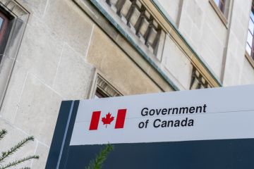 Government of Canada sign outside the office building in Ottawa, Ontario, Canada.