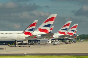 Tail fins of planes operated by British Airways at London Heathrow airport.