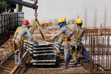Men from the construction industry, working on the work of a building under construction. Men from the construction industry, working on the work of a building under construction.
