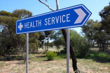 Directional road sign, to health services, small rural Outback town in Western Australia