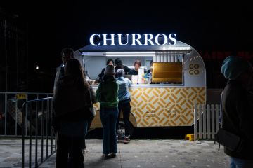People queuing for churros at the night market in Sydney, Australia People queuing for churros at the night market in Sydney, Australia
