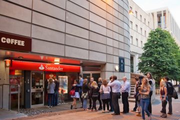 Queue of people waiting at a Santander ATM; central Edinburgh. Queue of people waiting at a Santander ATM; central Edinburgh.