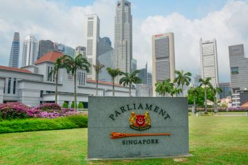 Facade of Singapore Parliament building Singapore, Singapore - July 3, 2015: The facade of Singapore Parliament building in front of Singapore downtown. The Parliament and the President jointly make up the legislature of Singapore.