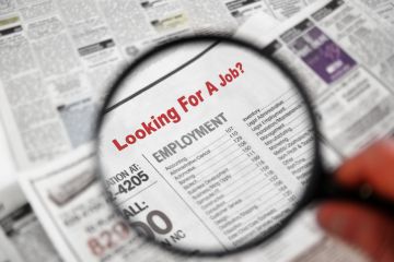 Magnifying glass searching job adverts