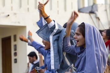 Female muslim students protest at a political rally in Lahore