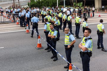 Protesters and Police officers outside the Hong Kong Queensway Pacific Place on October 13, 2014, Protesters and Police officers outside the Hong Kong Queensway Pacific Place on October 13, 2014.