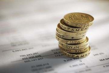 British pounds next to household bill