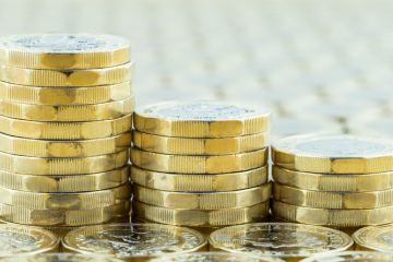  British money, three pound coins descending stacks.