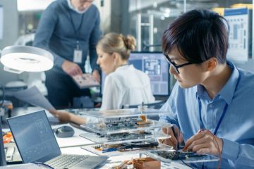 Computer scientist researching in their laboratory Computer scientist researching in their laboratory