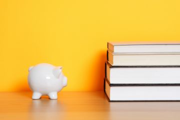 Piggy bank and books Piggy bank and books