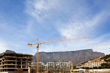 Table Mountain behind a construction site in Cape Town, South Africa Table Mountain behind a construction site in Cape Town, South Africa