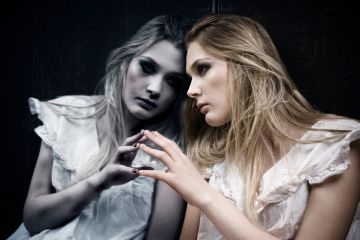 A woman looking at herself in the mirror A woman looking at herself in the mirror