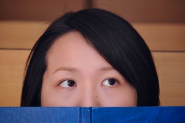 Female Chinese student with book