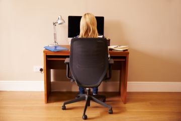 Woman working at a desk in a home office