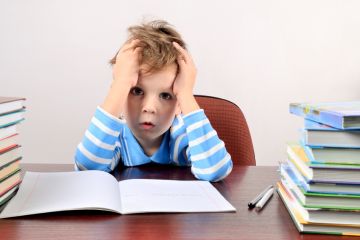 Boy struggling with schoolwork
