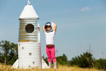 Happy child dressed in an astronaut costume Happy child dressed in an astronaut costume