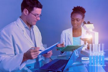 istock A senior white scientist and a junior black scientist A senior white scientist and a junior black scientist