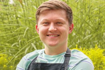 Josh Smalley in an apron that says University of Leicester