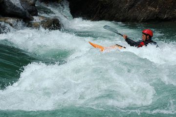 Person in a kayak paddling upstream. To illustrate that a one-off inflationary tuition fee rise will do little to help the financial instability of the higher education sector in England Person in a kayak paddling upstream. To illustrate that a one-off inflationary tuition fee rise will do little to help the financial instability of the higher education sector in England