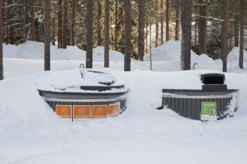 Finland public trash covered by snow Kittila, Finland - Feb 23, 2020 Finland public trash covered by snow.