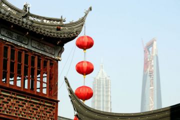 Red lanterns hanging from a temple roof in Shanghai