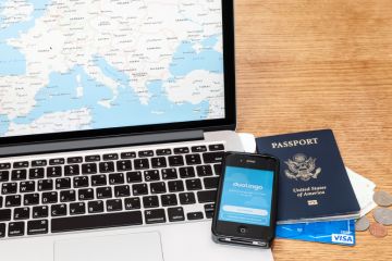 Laptop, passport, phone and credit card for travelling 