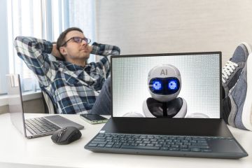 A human rest next to a computer with AI on its screen