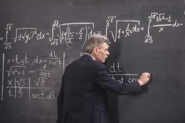 Lecturer in front of blackboard Lecturer in front of blackboard