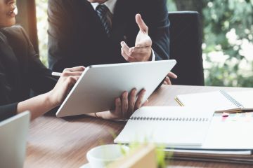 A lawyer offers advice to a student