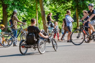 Leipzig, Germany - May 21, 2018 disabled man on the special handbike bicycle Leipzig, Germany - May 21, 2018 disabled man on the special handbike bicycle