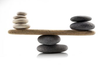 Stones balanced on a see-saw, symbolising the UK government's levelling up agenda