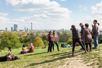 People photographing friends, Primrose Hill, London People photographing friends, Primrose Hill, London