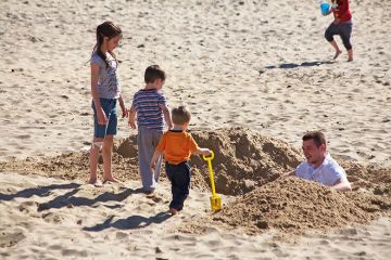 Digging a hole on the beach Digging a hole on the beach