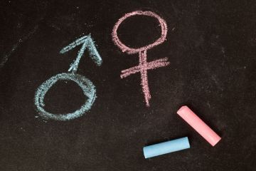 Male/female gender symbols drawn in chalk Male/female gender symbols drawn in chalk