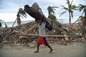 Man carrying corrugated tin