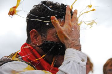 Man cracking egg on forehead Man cracking egg on forehead