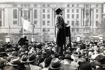Man speaking to large crowd of people Man speaking to large crowd of people
