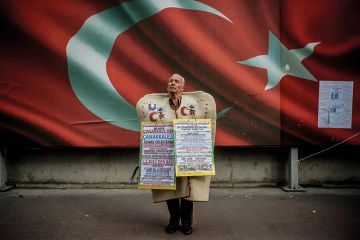 Man standing in front of Turkish national flag Man standing in front of Turkish national flag