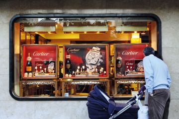Man window shopping for Cartier watches, Córdoba, Spain Man window shopping for Cartier watches, Córdoba, Spain