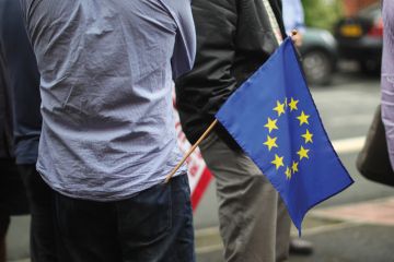 Man with European Union (EU) flag in back pocket Man with European Union (EU) flag in back pocket