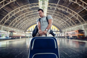 Man dragging heavy luggage