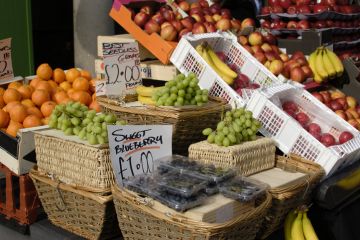 A fruit market with prices marked