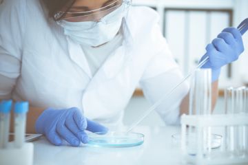 Masked student in laboratory