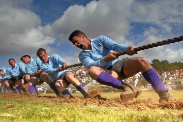 Men competing in tug of war