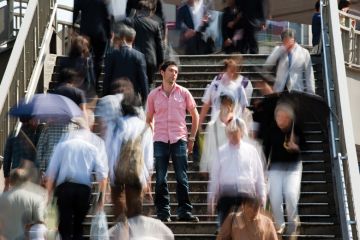 Man standing out from crowd. Man standing out from crowd.