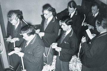 A group of men with ticker tape A group of men with ticker tape