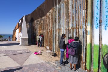 Mexican families living in Tijuana visit family members living in the US at the border wall in Playas de Tijuana