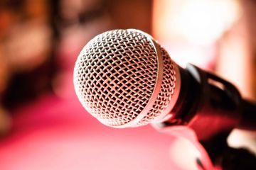 Microphone against red background (detail) Microphone against red background (detail)