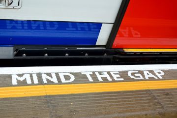 'Mind the Gap' sign painted on London Underground floor 'Mind the Gap' sign painted on London Underground floor