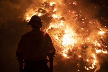 Monrovia, California  USA - September 15, 2020 Firefighters work the Bobcat Wildfire in the hills above Los Angeles.
